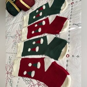 Four knitted sweater Christmas stockings